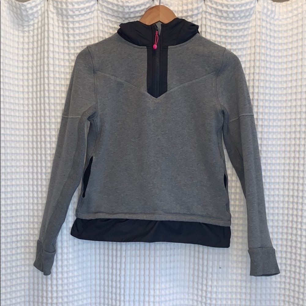 Grey Ivivva hooded sweatshirt with black trim.